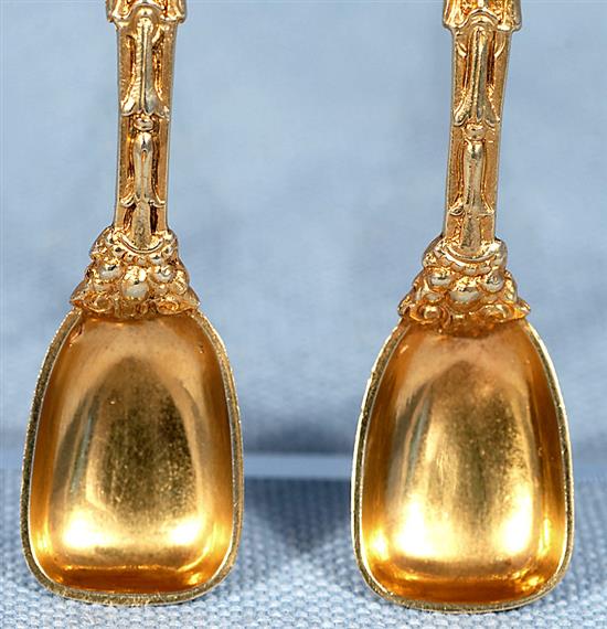 A good pair of Victorian cast silver gilt salt cellars and spoons, by Jane Brownett? height 40mm, weight 7.3 oz/230grms.